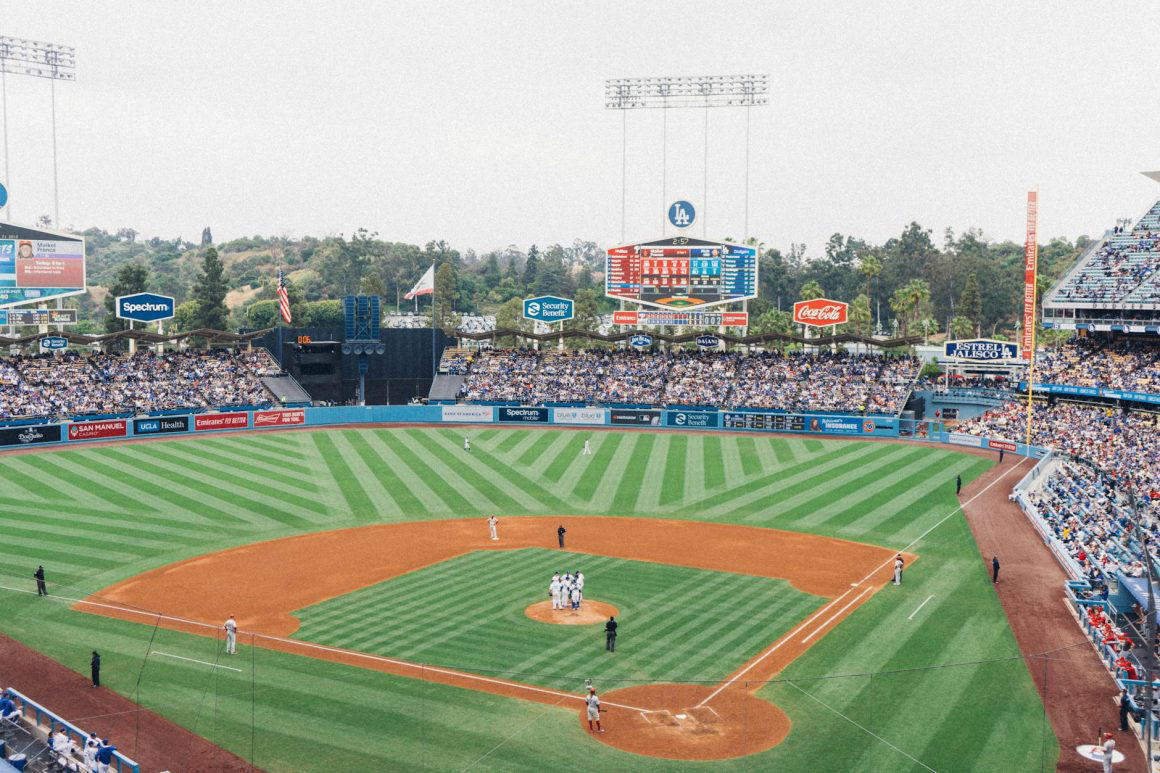 men playing baseball in stadium