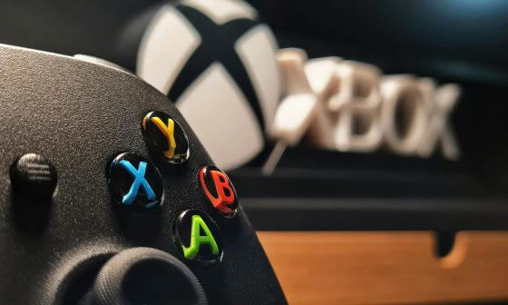 close up of xbox controller in gaming setup