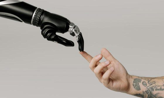 bionic hand and human hand finger pointing