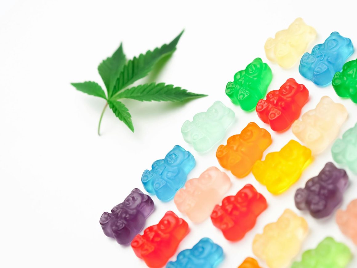 photo assorted colored gummy bears on white background